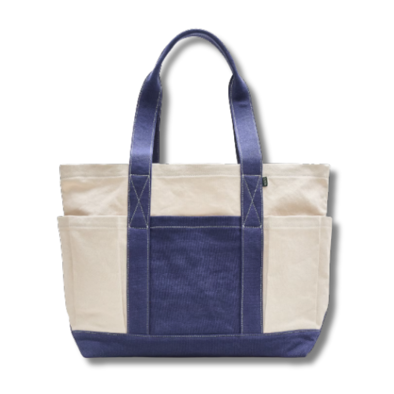Cream tote bag with navy blue in the middle and navy blue straps